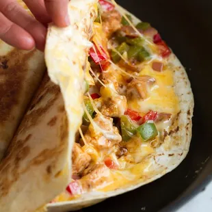 Quesadilla: Flour tortilla, cheese, choice of meat, lettuce, tomato and sour cream.