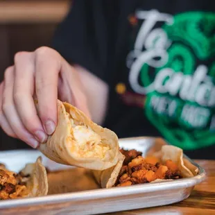 a person eating a burrito