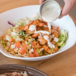 make it keto! Our grilled shrimp with no rice, just salad and pico and of course the creamy cilantro sauce!