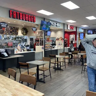 a man standing in a fast food restaurant