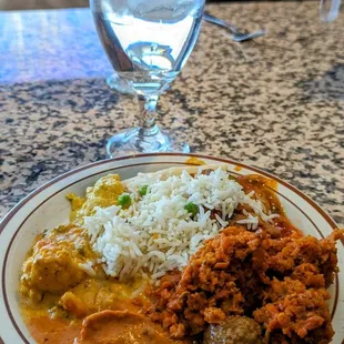 a plate of food and a glass of water