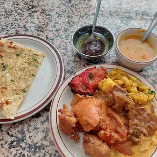 A mix from buffet, garlic Naan, &amp; vegetable soup. Goat Curry could have been just a bit more tender. Otherwise- a tasty meal! 9-23-22