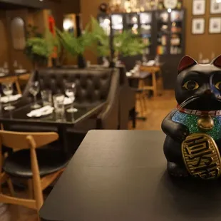 a cat figurine on a table