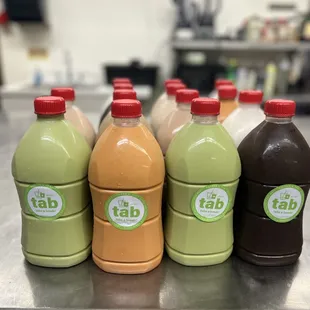 a row of bottles of tab juice