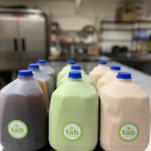 a row of bottles of tab milk