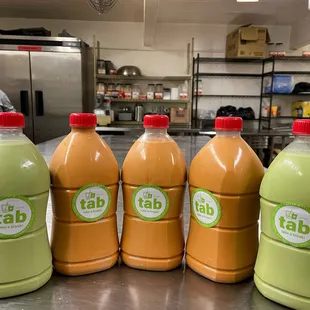 a row of bottles of tab juice