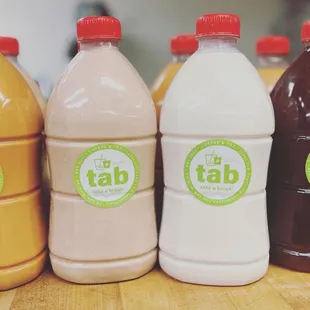 four bottles of tab milk