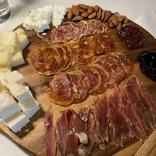 charcuterie board with hams and cheeses- very good