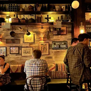 a group of people sitting at a bar
