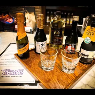 bottles of wine and glasses on a table