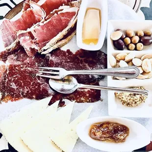 a platter of meats and cheeses