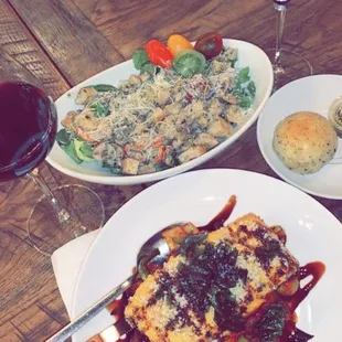 House salad, salmon over sautéed vegetables.