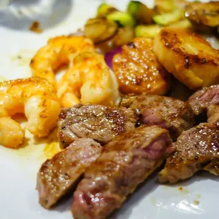 Steak, shrimp and scallops