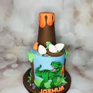  cake with a dinosaur on it