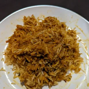 Restaurant is selling this dish Vijayawada boneless chicken biryani but it's literally chicken curry over rice