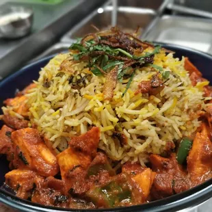 Paneer Biryani prepared with Basmati rice, Indian spices, and marinated Paneer