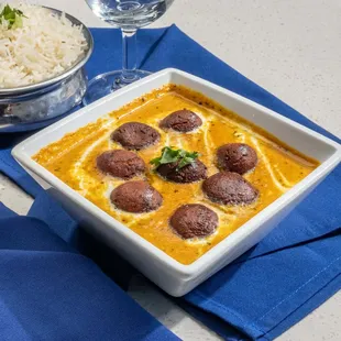 Malai Kofta - A North Indian Delicacy featuring Vegetable Balls
Cooked in Tomato Sauce