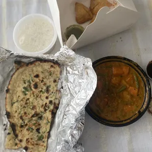 garlic naan, vegetable samosas, vegetable curry