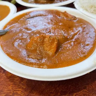 a plate of curry and rice