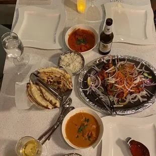 Chicken Tikka, Chicken Tikka Masala, butter chicken and a side of butter Naan.