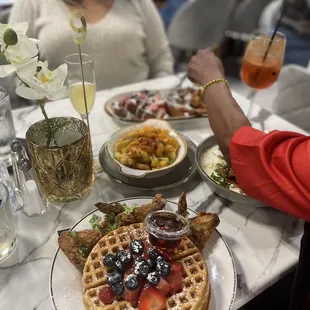 waffles, fruit, and drinks