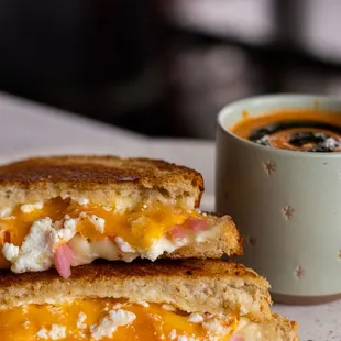 Gourmet Grilled Cheese | sourdough bread, cheddar cheese, swiss cheese, goat cheese, aioli, pickled onions