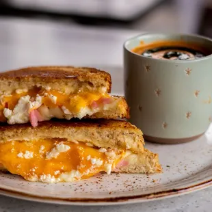 Gourmet Grilled Cheese | sourdough bread, cheddar cheese, swiss cheese, goat cheese, aioli, pickled onions