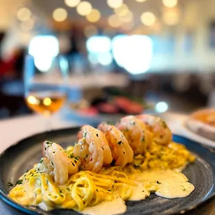 a plate of pasta and shrimp