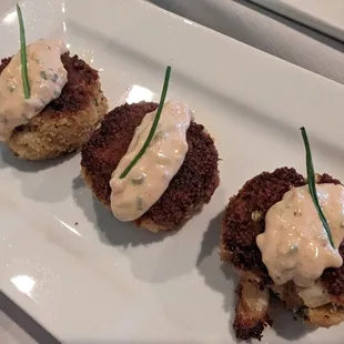 Crunchy, bite-size crab cakes with a sherry and spicy remoulade. Yum.