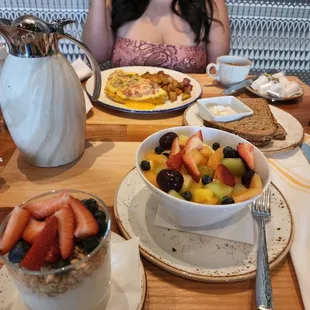 Omelet.  Bowl of fruit and parfae