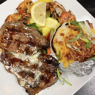 The choice of Sirloin and Shrimp Combo (grilled shrimp) with a fully baked potato.