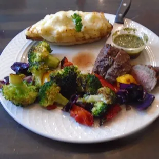 Bistro filet medallions (4 oz) with mixed veggies and twice baked potato.