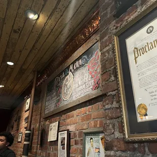 a brick wall with a plaque of the city of new york