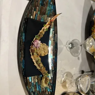 a plate of food and wine glasses