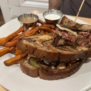 a grilled sandwich and sweet potato fries