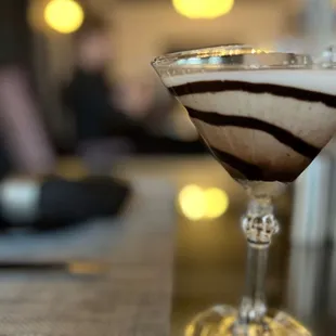 a close up of a drink in a martini glass