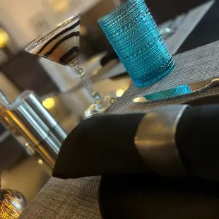 a glass of wine and a napkin