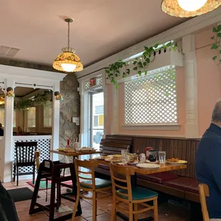 a man sitting at a table in a restaurant