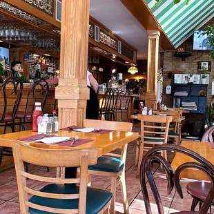 people sitting at tables in a restaurant