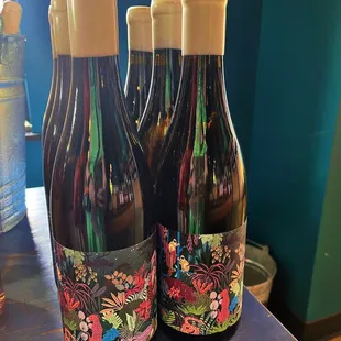 three bottles of wine on a table