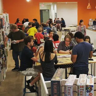 a large group of people in a library