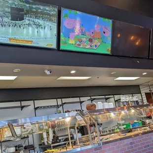 Buffet and TVs with shows for everyone. Naruto anime, Peppa pig, Ka&apos;bah Live Tawwaf.