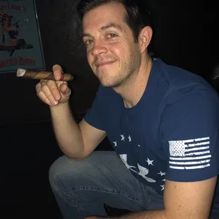 a man holding a cigar