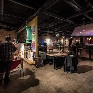 a man sitting at a table in a dimly lit room
