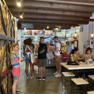 A few tables...you just sit anywhere there is a seat.