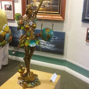 I absolutely fell in love with this piece! She got the whole world in her hands! The look of love &amp; simplicity on her face...priceless