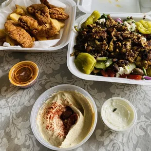 Greek salad, chicken tenders &amp; seasoned fries, hummus &amp; tzatziki