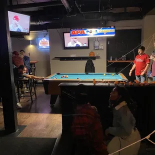 people playing pool