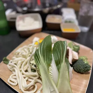 a plate of noodles and vegetables