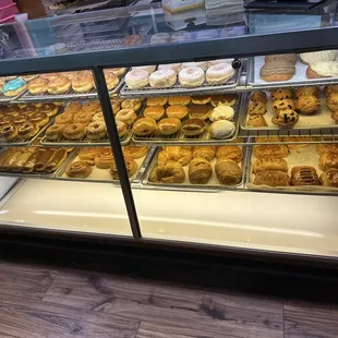 a display case filled with donuts
